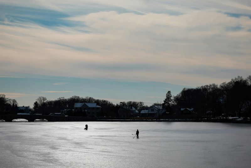 Afternoon Ice Skating on a Frozen Pond