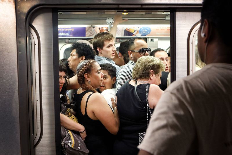 Standing in Subway Doors During Rush Hour