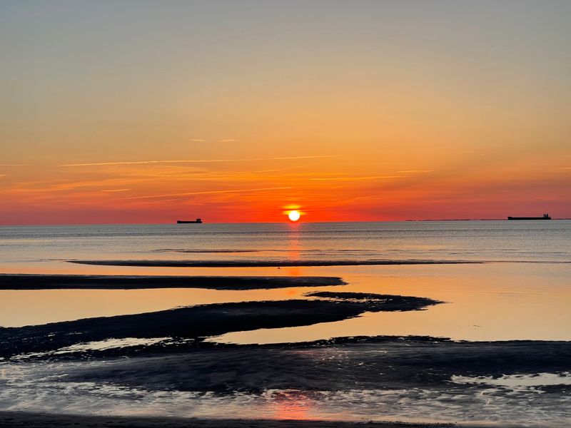 Calm, Shallow Bay Waters Create Mirror Reflections
