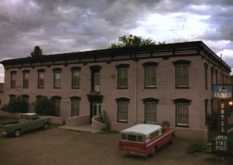 The Bullet-Scored Ceiling: Scars in the Parlor