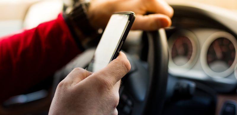 Using a Handheld Phone While Driving