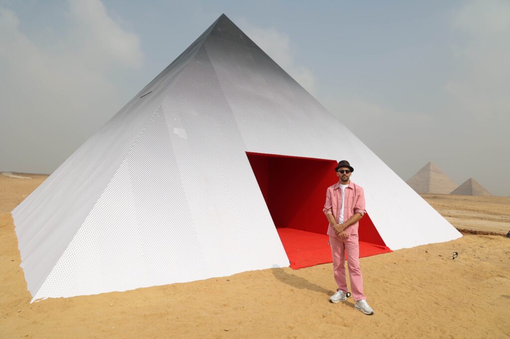 A photo booth shaped like a pyramid by French artist JR, from 2022 edition of "Forever is Now" by Art d’Egypte. c. AFP
