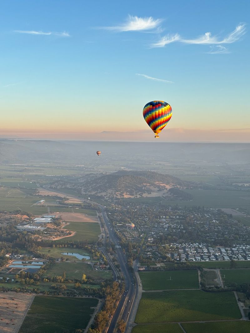 Hot air balloon sunrise with sky wide views and soft light