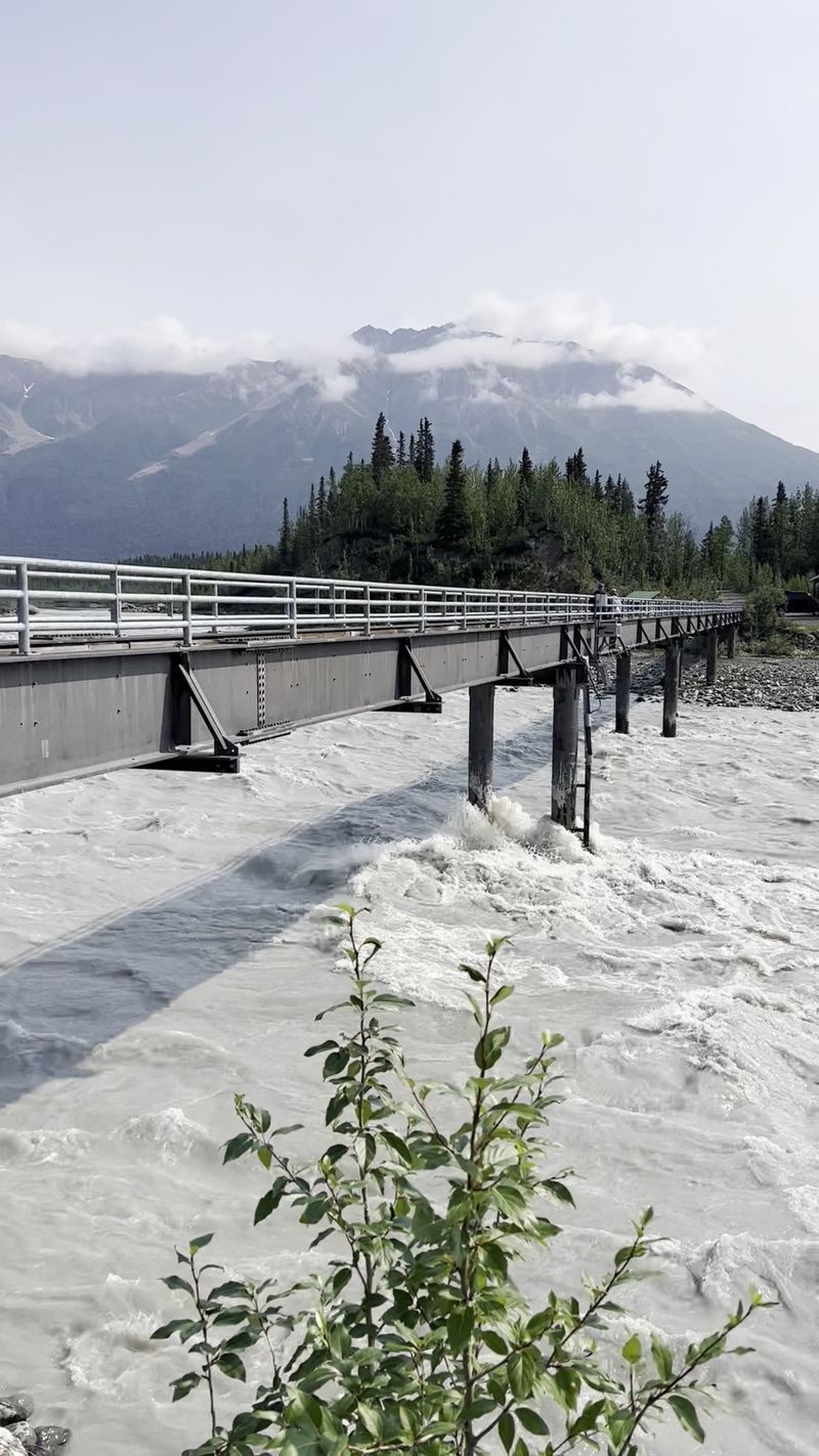Crossing the Kennicott River footbridge