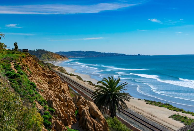 Sitting On Coastal Bluffs Beyond Rope Lines