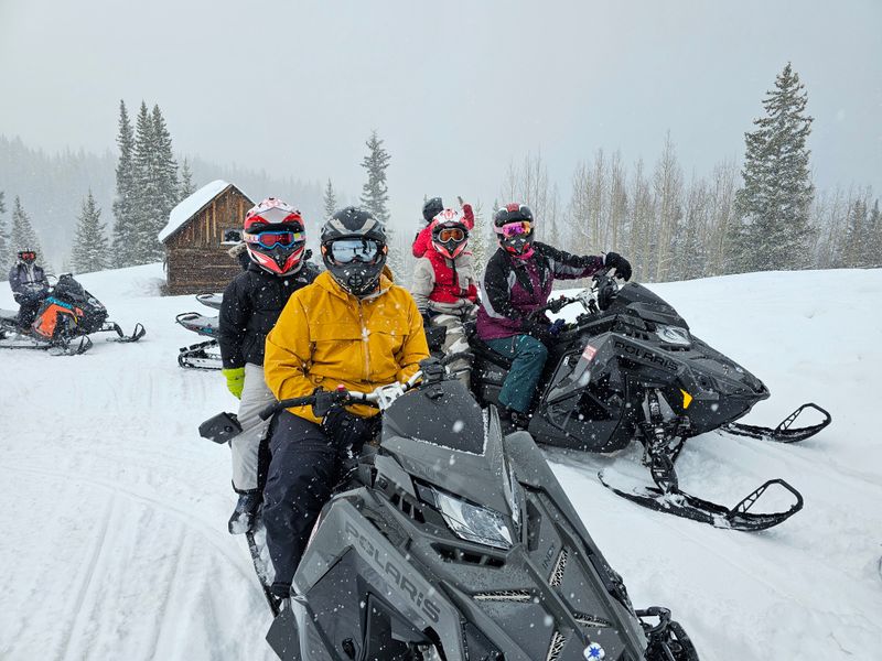 Ski Tracks And Snowmobiles At The Edge Of Town