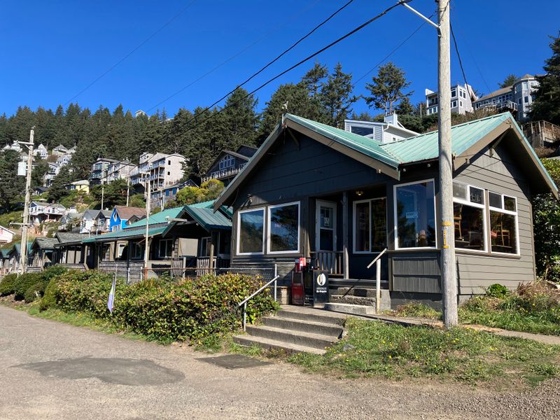 A hillside village with coastal cottages and sweeping stairs