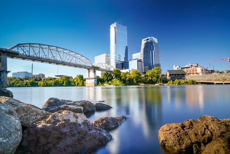 The Pedestrian Bridge As Evening Spine