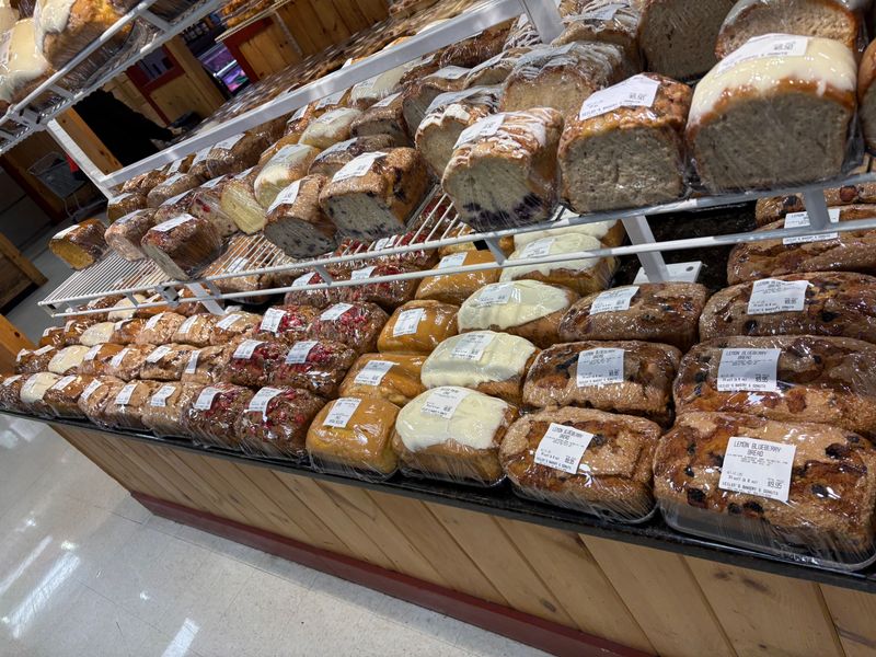 Bakery Section Bursting With Pies, Breads, And Baked Treasures