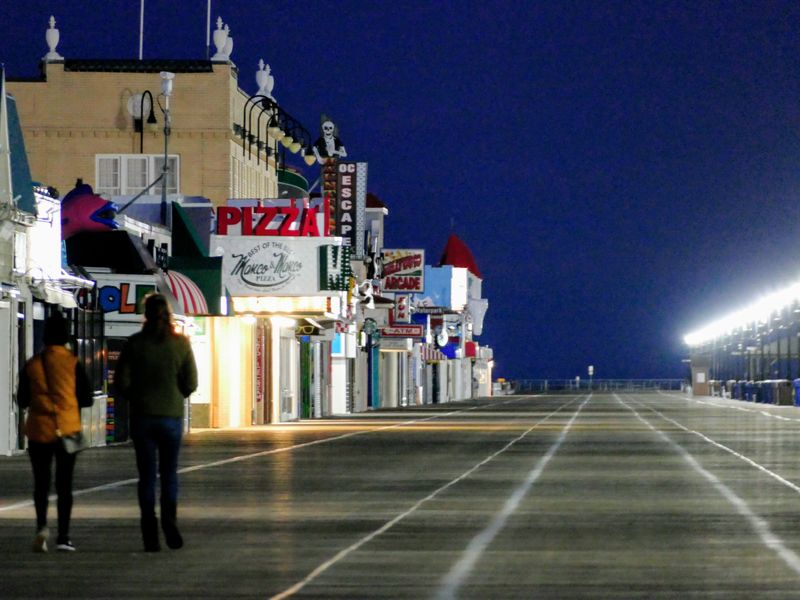 Locals Walking Past A Frozen Landmark