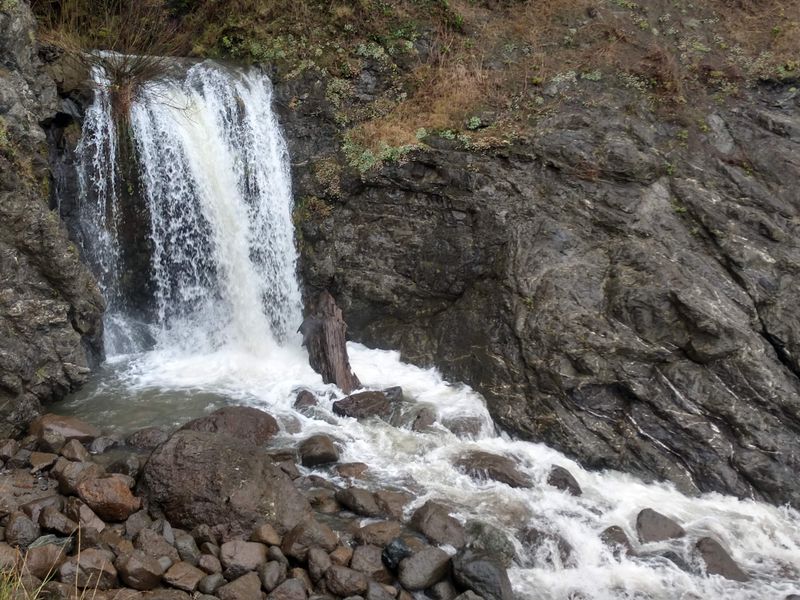 Winter Waterfall Flowing Onto Sand