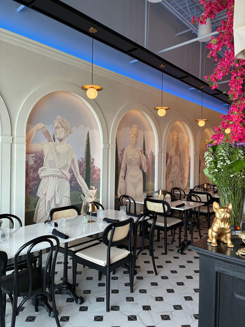 Hand-Painted Murals Transform the Space Into Parisian Paradise
