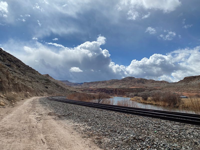 A Canyon Entrance Sitting Just Beyond Backyards And Fields