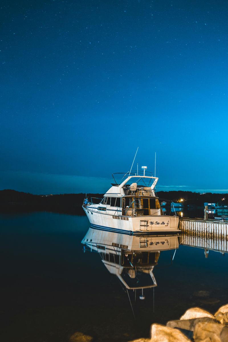 Ferry Watching And Distant City Glow Out On The Water