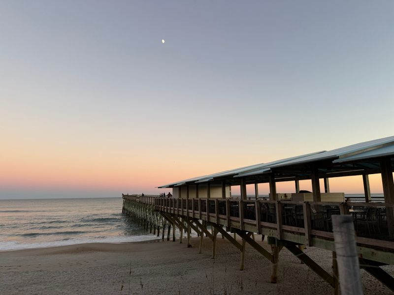 An Oceanfront Dining Room Set Directly On The Shoreline
