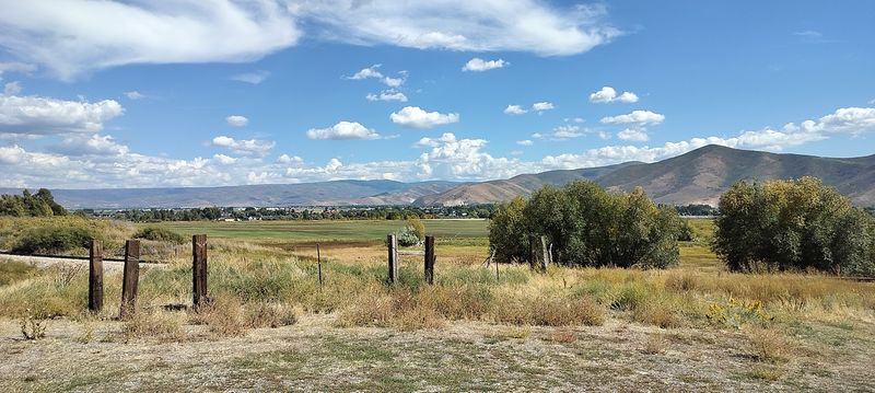 A Valley Town That Pops Green Against The Peaks