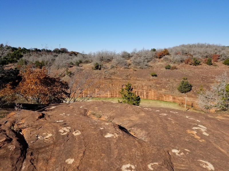 Red Sandstone Cliffs Rise Like Ancient Sentinels