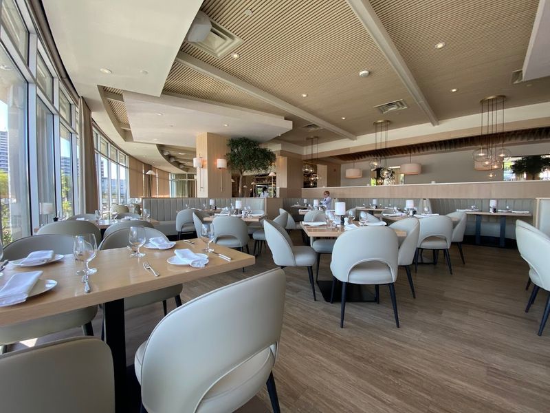 A Modern Atmosphere With a Wood-Fired Hearth and Open Kitchen