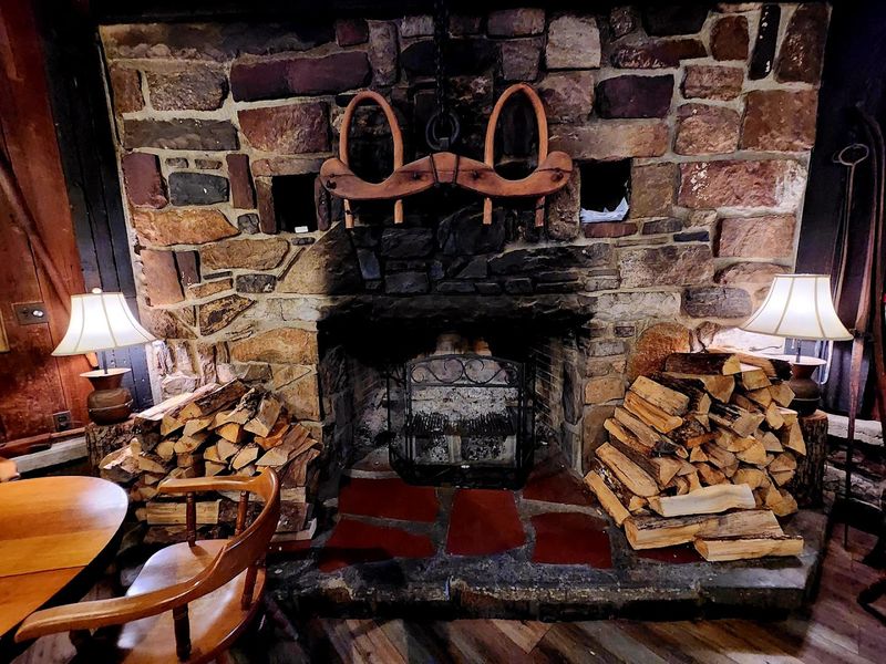 The Stone Fireplace and Wooden Rafters That Set the Mood Perfectly