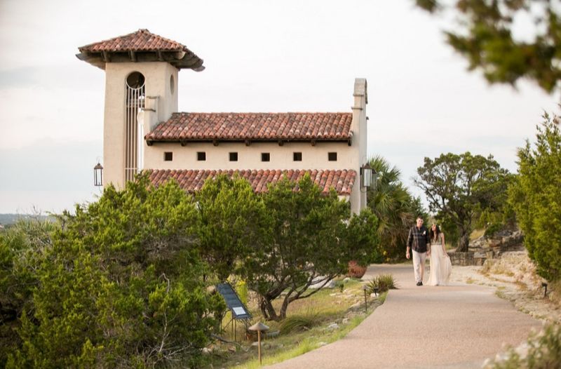 The Winding Path to the Chapel Lined With Flowers and Wildlife