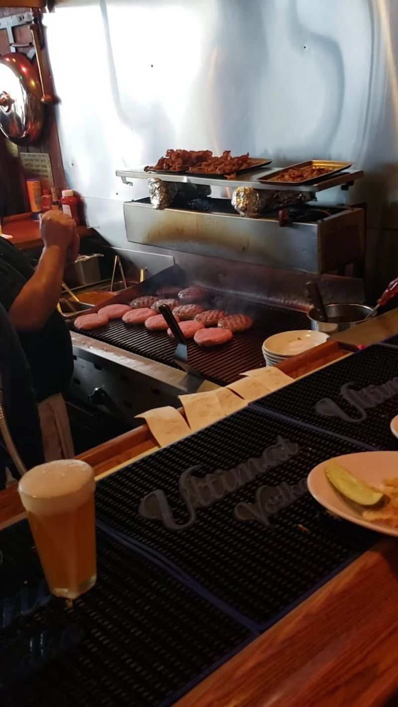 The Open-Flame Grill Behind the Bar