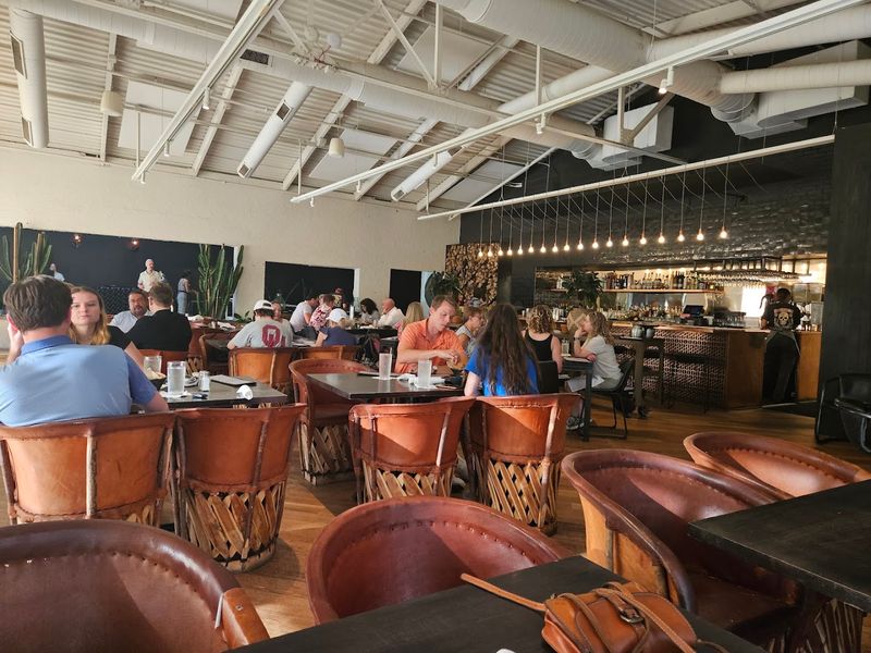 The Wood-Fired Aroma Sets the Mood Before You Even Sit Down