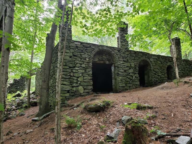 Best Photo Angles That Capture The Arch, Stonework, And Forest Mood