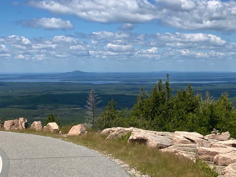 A Summit Road With Pullouts, Pavement, And Constant Visitor Pressure