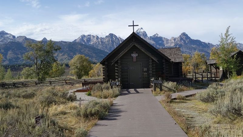 A Tiny Landmark Set Against Enormous Teton Peaks