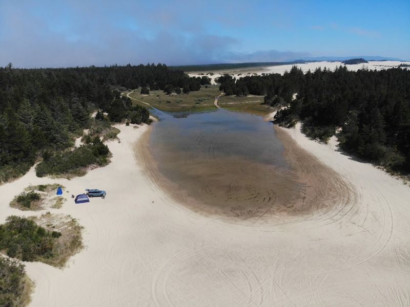 Camping Under the Stars at the Edge of the Dunes
