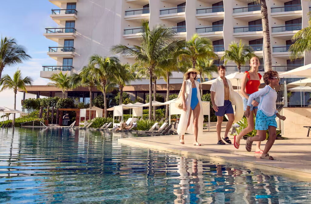All ages will love the oceanfront pools at the Cancun Hilton Resort. photo c. Hilton