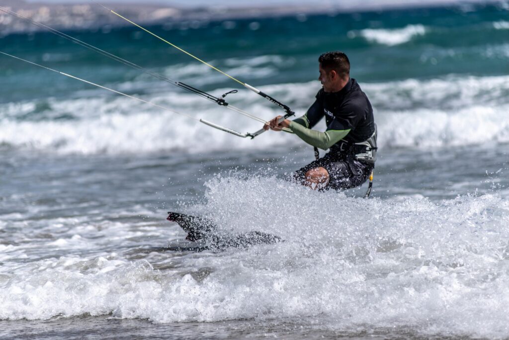Kite surfing is just one of the many watersports the island is known for. c.  Norbert Norbi for pexels.