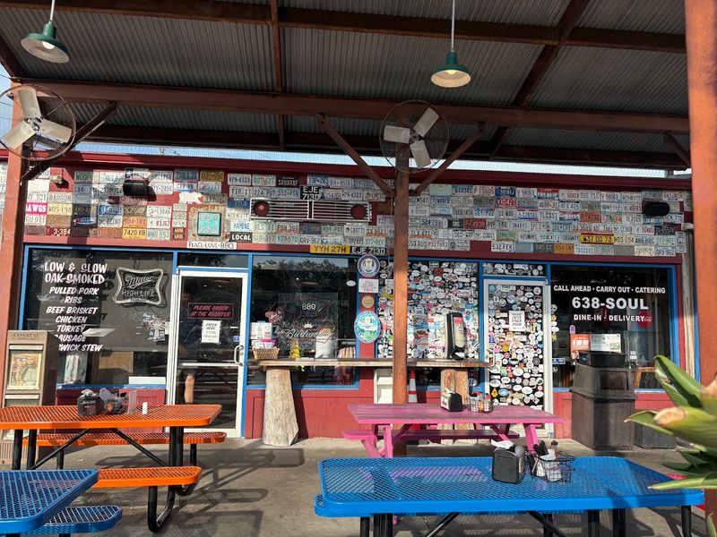 License Plates And Old Signs Covering Every Wall