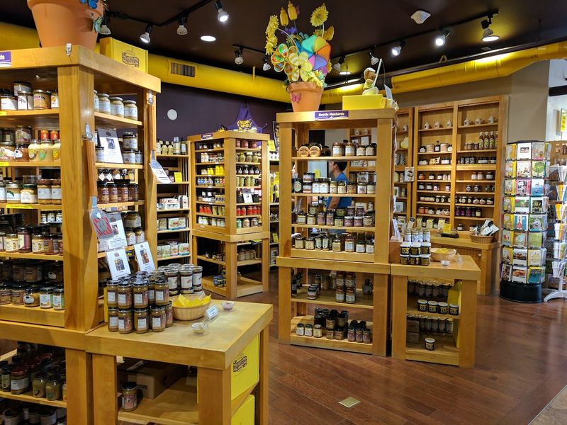 Warm Wood Tones And A Giant Yellow Ceiling Pipe Inside