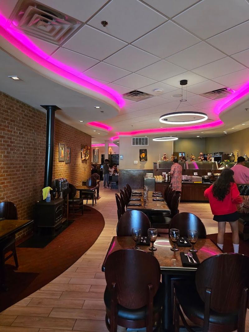 The Warm Atmosphere With Authentic Indian Art and a Fireplace