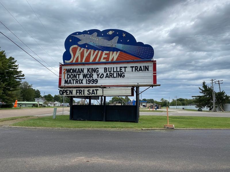 The Rocket Ship Sign Illuminating The Night Sky