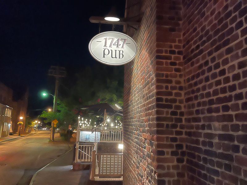 A Georgian Building With A Gambrel Roof
