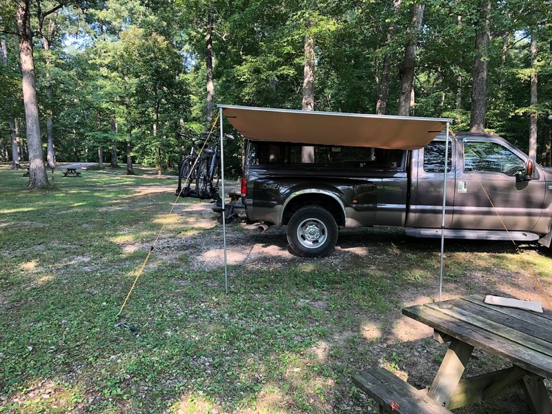 Camping Beneath A Canopy Of Towering Hardwoods