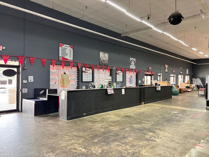 Concrete Floors, Industrial Lights, And International Flags