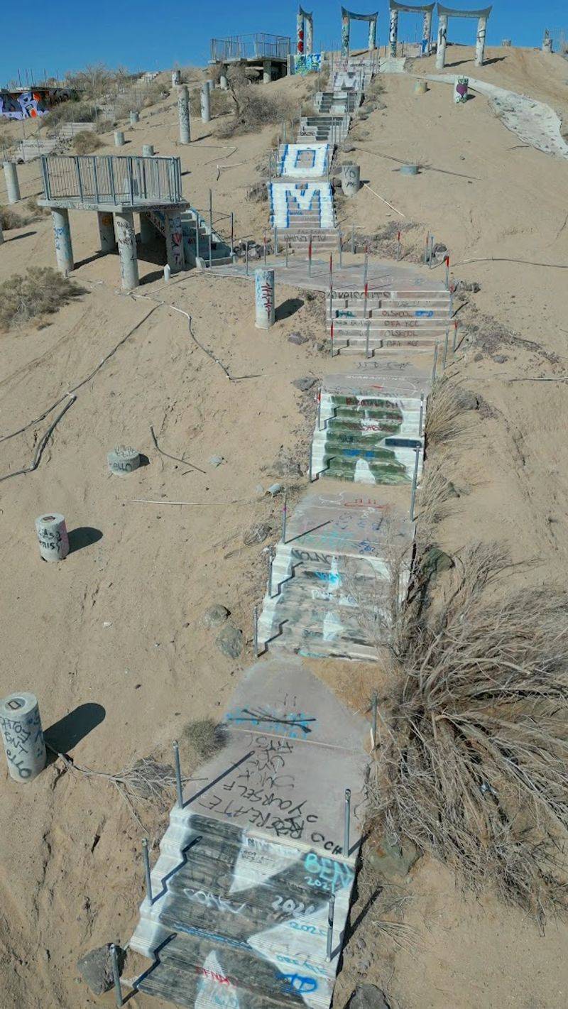 Sand Drifting Across Empty Walkways