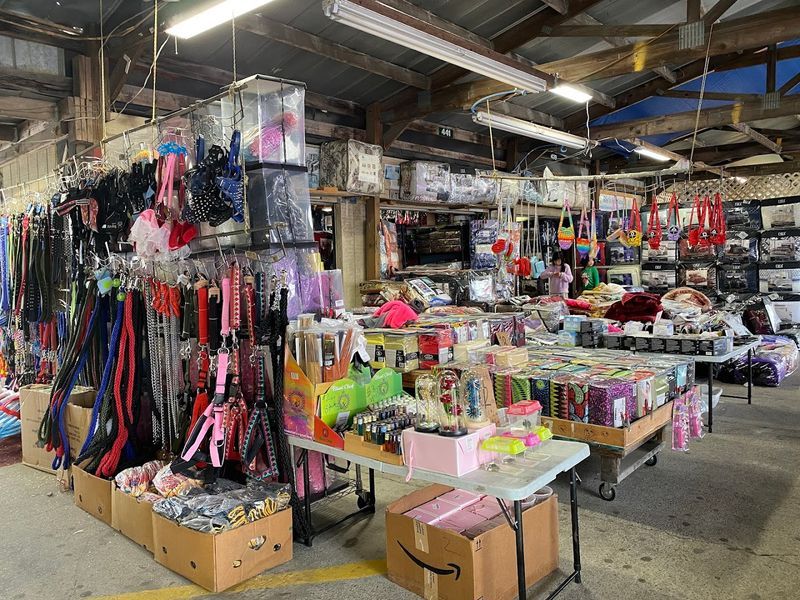 Paved Parking And Long Covered Buildings Under One Roof