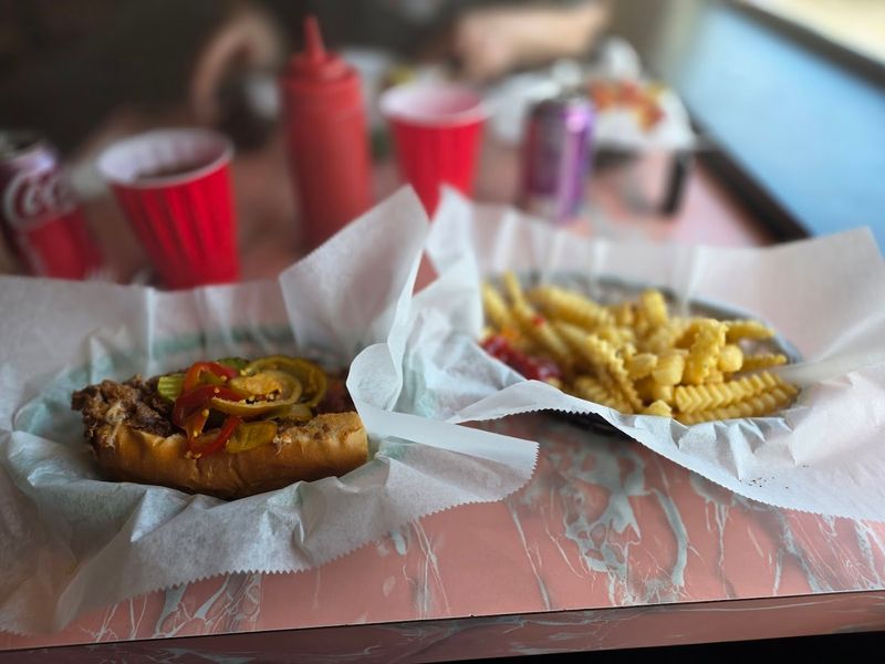 Wooden Tables Worn Smooth By Decades Of Diners
