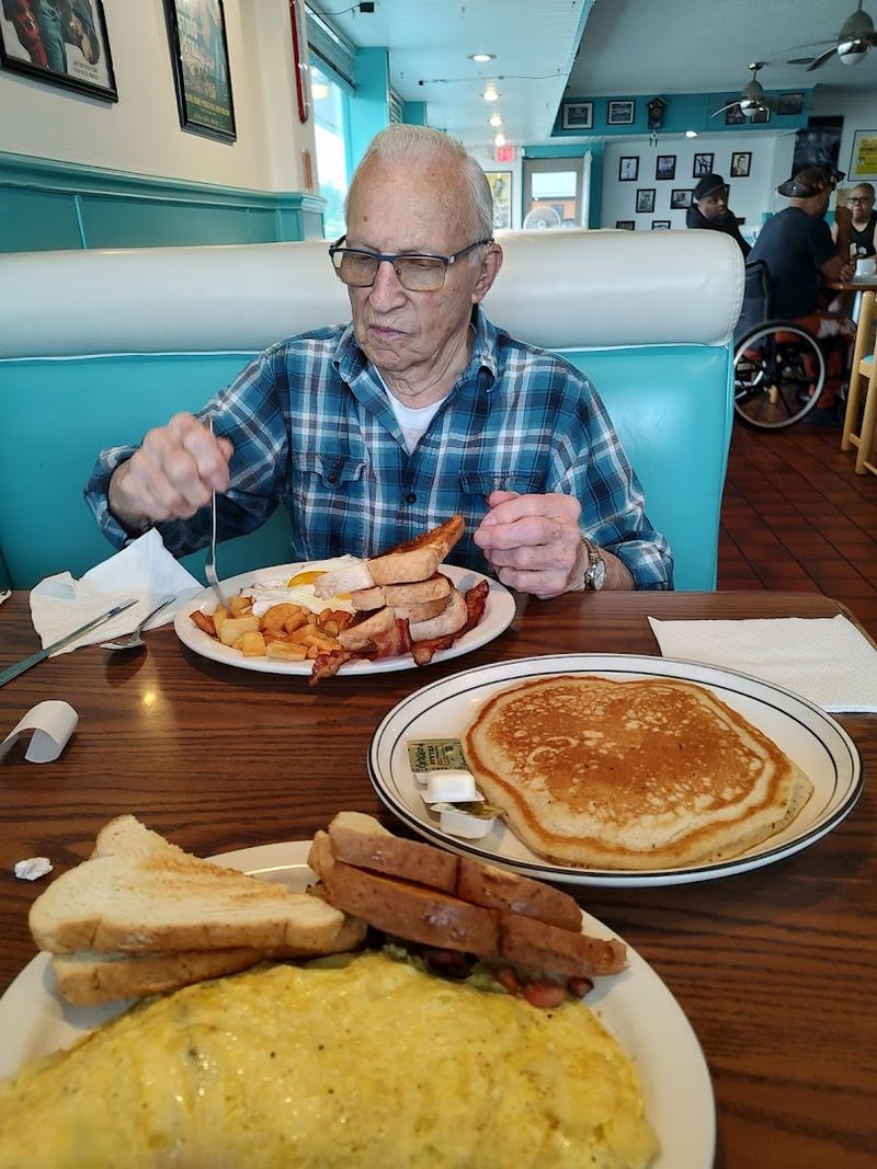 Vintage Car Pictures And Race Car Decals On The Walls