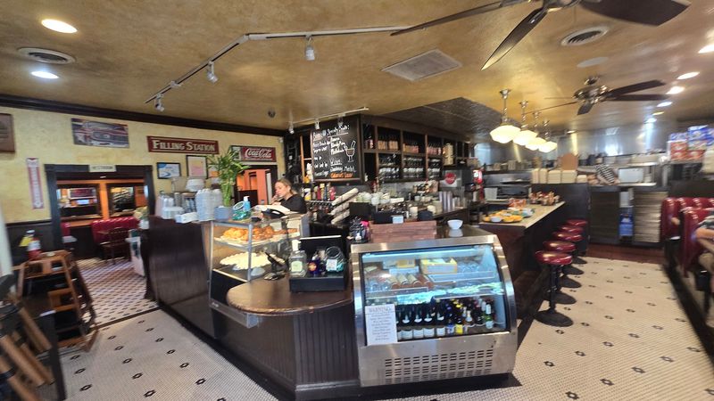 Classic Red Vinyl Booths Lining The Warm Yellow Walls