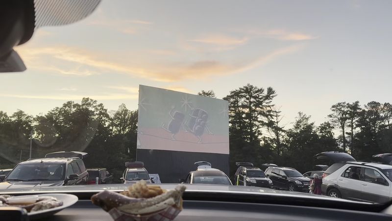 A Curved 40x72 Foot Screen Rising Above The Grass