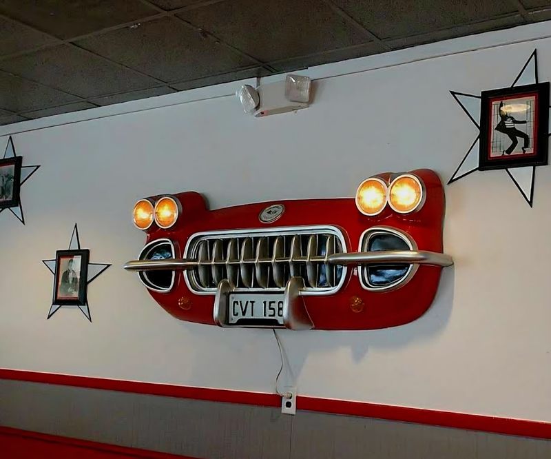 Vintage Signs And Old License Plates Covering The Walls
