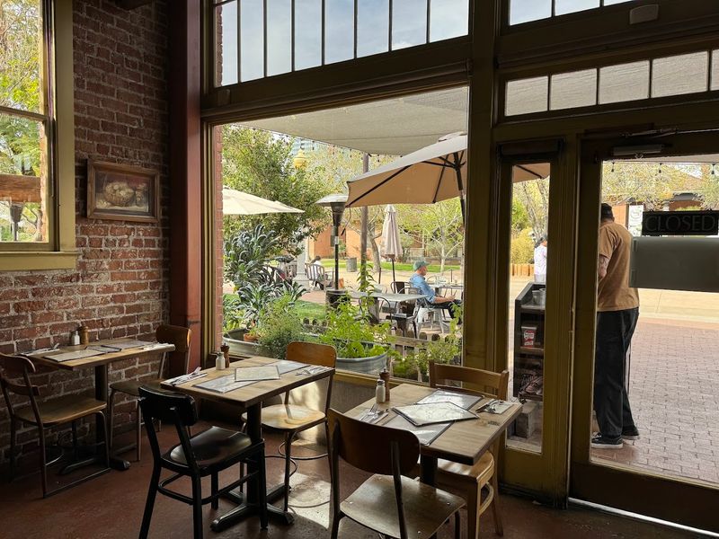 Homey With Wood Tables And Warm Hued Walls
