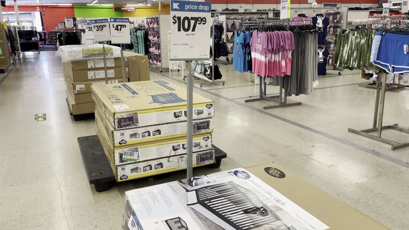 The Quiet Aisles With Scattered Shelves And Blue Light Signs