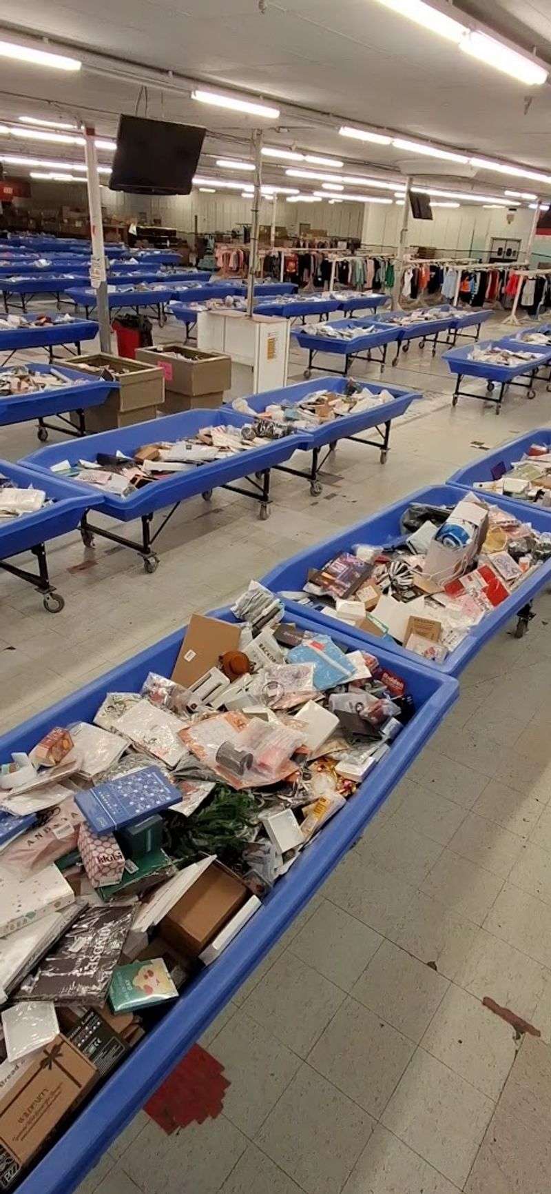 Large Bins Overflowing With Sealed Mystery Packages