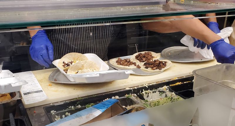 A Line Of Locals Forming Before Noon